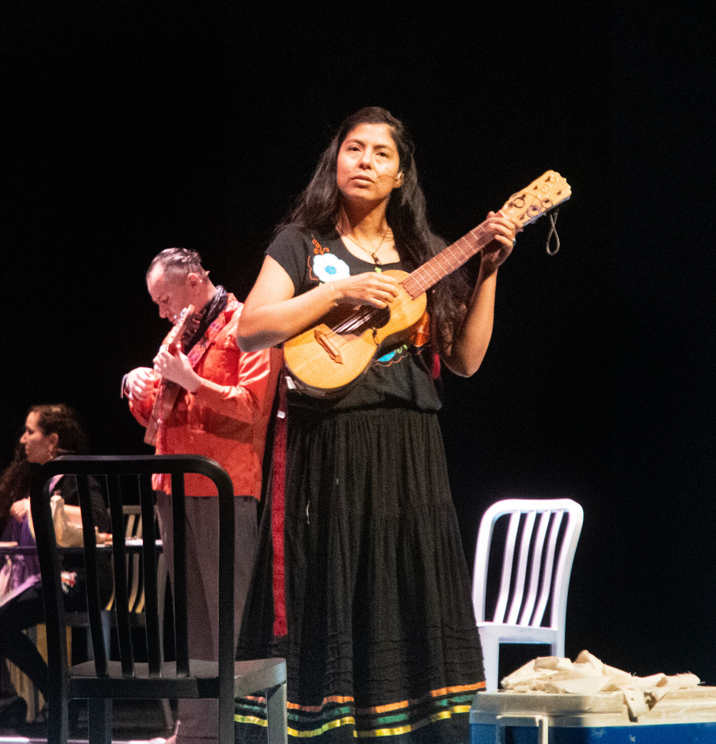 Actor Jen Anaya tunes instrument before 'Fandango for Butterflies (and Coyotes)' performance